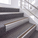 Mill Finish single insert chevron stair nosing, 65mm riser with Brown insert, fitted on carpeted stairs