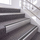 Mill Finish single insert chevron stair nosing, 65mm riser with Dark Grey insert, fitted on carpeted stairs