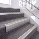 Mill Finish single insert chevron stair nosing, 65mm riser with Oyster insert, fitted on carpeted stairs