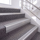 Mill Finish single insert chevron stair nosing, 65mm riser with Polar Grey insert, fitted on carpeted stairs