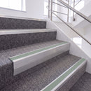 Mill Finish single insert chevron stair nosing, 65mm riser with Sage Green insert, fitted on carpeted stairs