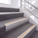 Mill Finish single insert chevron stair nosing, 65mm riser with Sahara insert, fitted on carpeted stairs