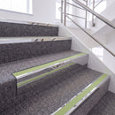 Mirrorflect Silver single insert chevron stair nosing, 65mm riser with Apple Green insert, fitted on carpeted stairs