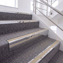 Mirrorflect Silver single insert chevron stair nosing, 65mm riser with Beige insert, fitted on carpeted stairs