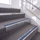 Mirrorflect Silver single insert chevron stair nosing, 65mm riser with Blue insert, fitted on carpeted stairs