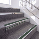 Mirrorflect Silver single insert chevron stair nosing, 65mm riser with Dark Green insert, fitted on carpeted stairs