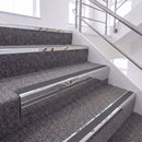 Mirrorflect Silver single insert chevron stair nosing, 65mm riser with Dark Grey insert, fitted on carpeted stairs