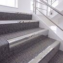 Mirrorflect Silver single insert chevron stair nosing, 65mm riser with Oyster insert, fitted on carpeted stairs