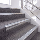 Mirrorflect Silver single insert chevron stair nosing, 65mm riser with Polar Grey insert, fitted on carpeted stairs