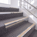 Mirrorflect Silver single insert chevron stair nosing, 65mm riser with Sahara insert, fitted on carpeted stairs