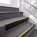 Satin Black single insert chevron stair nosing, 65mm riser with Apple Green insert, fitted on carpeted stairs