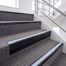 Satin Black single insert chevron stair nosing, 65mm riser with Aura insert, fitted on carpeted stairs