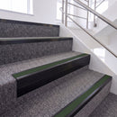 Satin Black single insert chevron stair nosing, 65mm riser with Dark Green insert, fitted on carpeted stairs