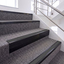 Satin Black single insert chevron stair nosing, 65mm riser with Dark Grey insert, fitted on carpeted stairs
