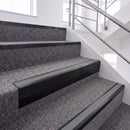 Satin Black single insert chevron stair nosing, 65mm riser with Mid Grey insert, fitted on carpeted stairs