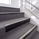Satin Black single insert chevron stair nosing, 65mm riser with Oyster insert, fitted on carpeted stairs