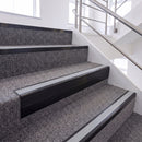 Satin Black single insert chevron stair nosing, 65mm riser with Polar Grey insert, fitted on carpeted stairs
