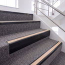 Satin Black single insert chevron stair nosing, 65mm riser with Sahara insert, fitted on carpeted stairs