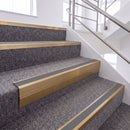 Satin Bronze single insert chevron stair nosing, 65mm riser with Mid Grey insert, fitted on carpeted stairs