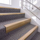 Satin Bronze single insert chevron stair nosing, 65mm riser with Sahara insert, fitted on carpeted stairs