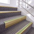 Satin Gold single insert chevron stair nosing, 65mm riser with Apple Green insert, fitted on carpeted stairs