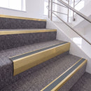 Satin Gold single insert chevron stair nosing, 65mm riser with Mid Grey insert, fitted on carpeted stairs