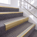 Satin Gold single insert chevron stair nosing, 65mm riser with Oyster insert, fitted on carpeted stairs