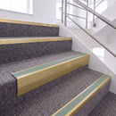 Satin Gold single insert chevron stair nosing, 65mm riser with Sage Green insert, fitted on carpeted stairs