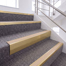 Satin Gold single insert chevron stair nosing, 65mm riser with Sahara insert, fitted on carpeted stairs