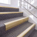 Satin Gold single insert chevron stair nosing, 65mm riser with White insert, fitted on carpeted stairs