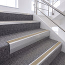 Satin Silver single insert chevron stair nosing, 65mm riser with Beige insert, fitted on carpeted stairs