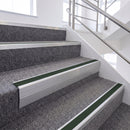 Satin Silver single insert chevron stair nosing, 65mm riser with Dark Green insert, fitted on carpeted stairs
