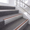 Satin Silver single insert chevron stair nosing, 65mm riser with Mid Brown insert, fitted on carpeted stairs