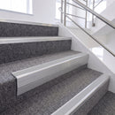Satin Silver single insert chevron stair nosing, 65mm riser with Polar Grey insert, fitted on carpeted stairs