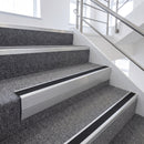 Satin Silver single insert chevron stair nosing, 65mm riser with Premium Black insert, fitted on carpeted stairs