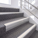 Satin Silver single insert chevron stair nosing, 65mm riser with White insert, fitted on carpeted stairs