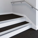Cloud PVC insert fitted in aluminium stair nosings on an office staircase