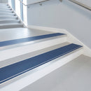 Cobalt blue PVC insert fitted in aluminium stair nosings on a leisure centre staircase