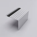 65x55mm square concealed fix aluminium stair nosing profile on a plain studio background, fluted tread and cover strip visible