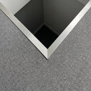 Matt brushed aluminium welded corner angle turning the open corner of a carpeted landing above a stairwell