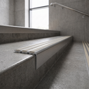 Raked back carborundum nosing with Portland stone coloured grit insert
