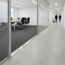 Aluminium Z-profile carpet bar installed at commercial office meeting room doorway