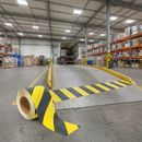 100mm black yellow chevron tape on loading ramp surface — anti-slip hazard marking