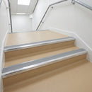 Dolphin grey PVC insert fitted in aluminium stair nosings on a shopping centre staircase