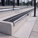 Mirror polished silver 84mm double channel bullnose aluminium stair nosing with twin Coal black gritted exterior-grip inserts fitted on leisure centre entrance steps