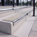 Mirror polished silver 84mm double channel bullnose aluminium stair nosing with twin Everest light grey gritted exterior-grip inserts fitted on leisure centre entrance steps