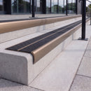 Satin bronze 84mm double channel bullnose aluminium stair nosing with twin Coal black gritted exterior-grip inserts fitted on leisure centre entrance steps