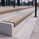 Satin bronze 84mm double channel bullnose aluminium stair nosing with twin Everest light grey gritted exterior-grip inserts fitted on leisure centre entrance steps