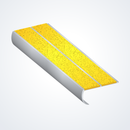 Studio cut-away of 84 x 37mm double channel bullnose aluminium stair nosing showing twin gritted Brimstone exterior-grip inserts and curled bullnose leg