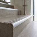 Bullnose double channel aluminium stair nosing 98x40mm fitted to a concrete step, twin Flint Castellated inserts